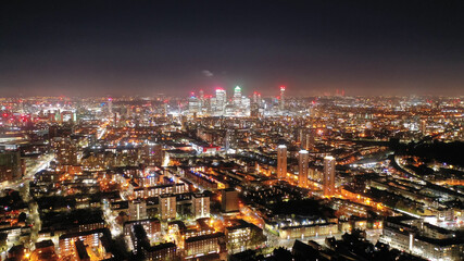Obraz premium Aerial drone photo of iconic skyscraper banking and business complex of Canary Wharf at sunset, Docklands, London, United Kingdom