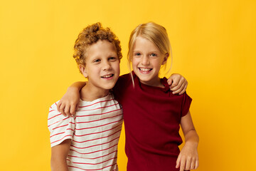 two joyful children casual wear games fun together isolated background