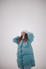 a beautiful girl walks on a frozen lake