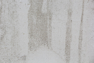 Texture. Gray wall covered with plaster. Uneven surface.