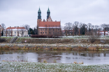 View on Poznan Cathedral - Archcathedral Basilica of St. Peter and St. Paul from the Warta river - obrazy, fototapety, plakaty