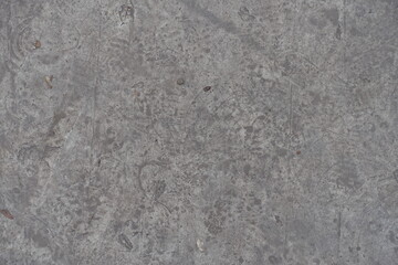 Background - dirty and scratched gray concrete slab from above