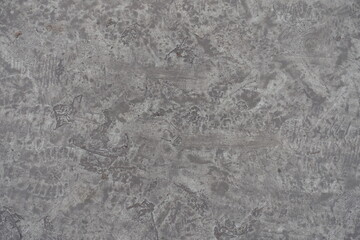 Naklejka premium dirty and scratched gray concrete slab from above