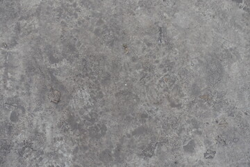 Surface of dirty and scratched gray concrete slab from above