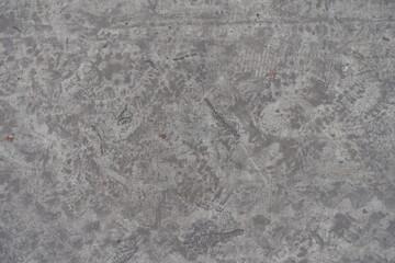 Top view of dirty and scratched gray concrete slab