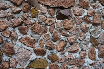 Close shot of multicolored gravel pebble dash on the wall