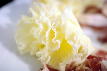 close up of a plate of cheese and ham