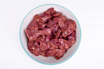 Healthy offal. Raw chicken liver on white. Studio Photo