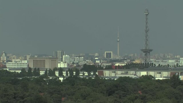 Silhouette of Berlin with TV Tower, Messeturm and Grunewald Forest in front, Germany.