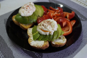 Morning Breakfast toast with cream cheese and avocado poached egg pepper