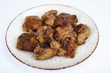 Cooked chicken liver on plate. Liver dishes. Studio Photo