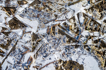 Ice texture with crystals and graphic patterns. Winter textured surface photo.