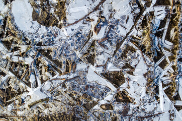 Ice texture with crystals and graphic patterns. Winter textured surface photo.