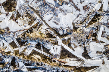 Ice texture with crystals and graphic patterns. Winter textured surface photo.