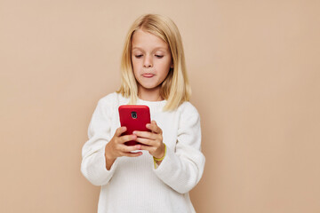 Little cute girl red phone in hand kids lifestyle concept