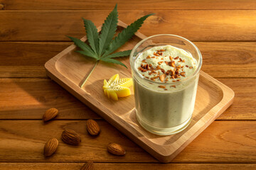 Close up Bhang Lazzi Indian Tea with cannabis serves with almond crumbles and piece of cannabis...