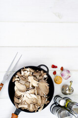 Vegetarian meals. Oyster mushrooms in pan for cooking. Studio Photo