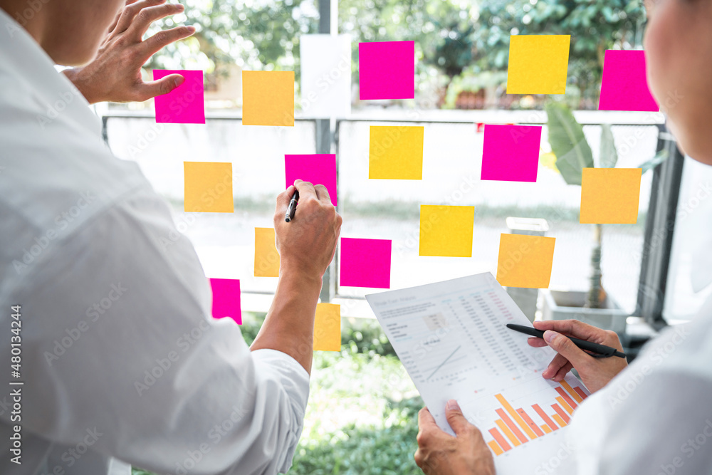 Poster business team working marketing growth on financial document graph report statistics, using post it 