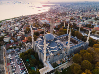 Aerial view of Blue Mosque with six minarets in Istanbul, Turkey. Top view of tourist famous place Sultanahmet Camii  in the old city center on sunset