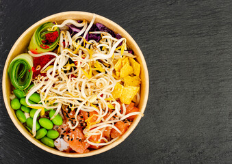 Traditional Hawaiian dish of fresh salmon, rice, vegetables and fruits. Studio Photo