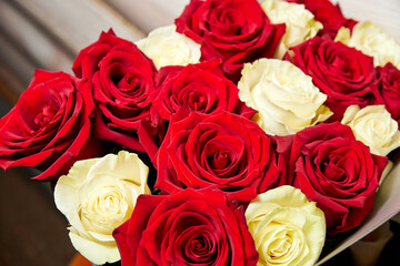 Bouquet of red and yellow roses. Close-up, selective focus.