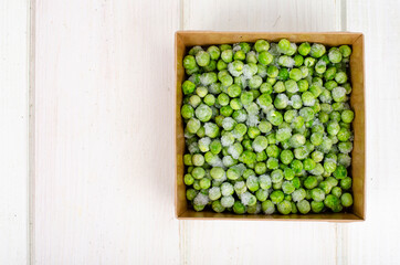 Frozen green peas, preservation of vitamins and vegetables. Studio Photo