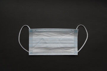 Medical mask isolated on background. Close-up of Coronavirus or COVID-19 protective face mask....