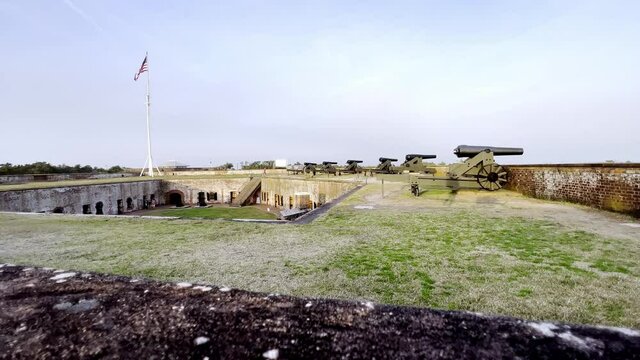 wide shot of fort and flag at fort macon state park near beaufort nc, north carolina