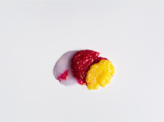 Set multicolored smears of scrub on white background. Cosmetic product. Cleansing and exfoliating your skin. Copy space