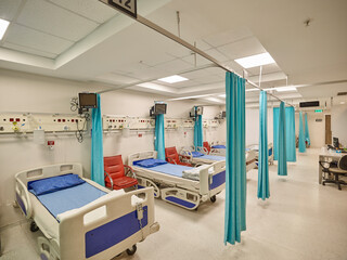 Photographs of hospital interiors, general rooms and medical supplies.