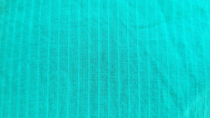 green cotton fabric with stripes background close-up