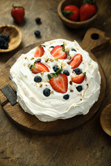 Pavlova meringue dessert with fresh berries