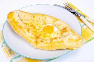 Homemade cakes with cheese. Khachapuri in Adjarian. Studio Photo