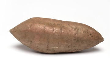 Closeup ripe sweet potato tuber white background