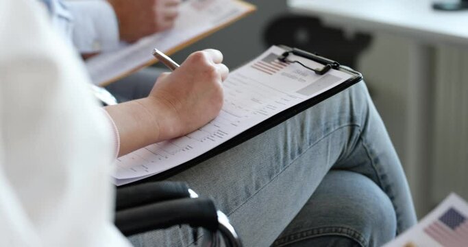 People fill out American visa application form by filling out paperwork