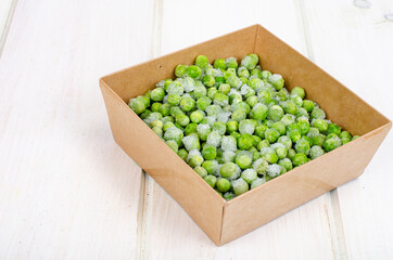 Frozen green peas, preservation of vitamins and vegetables. Studio Photo