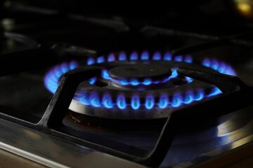 Gas stove and burning gas. 
Very expensive gas in Poland and Europe 
