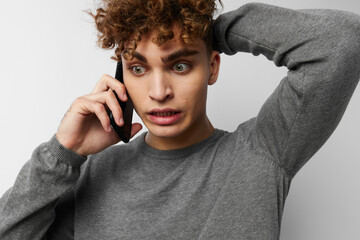 stylish guy looking at the phone fashion isolated background