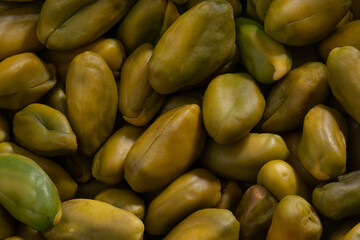Detailed and large close up shot of pistachios.