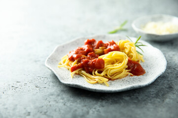 Pasta with tomato sauce and roseamry