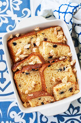 Bread (panettone) pudding from leftovers with custard and raisins.