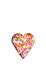 Multi-colored heart-shaped sprinkles pastry topping in heart form, minimalistic saint valentine`s day greeting card
