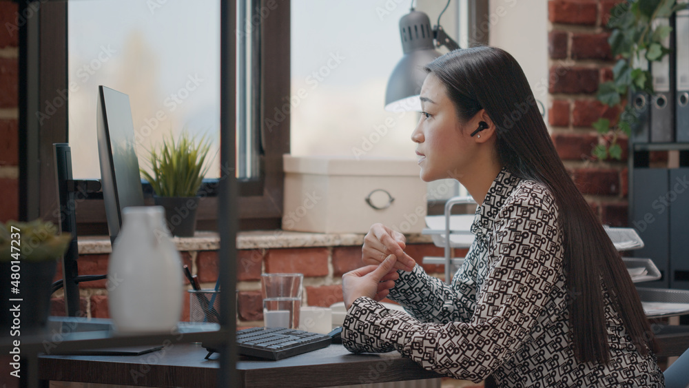 Poster employee talking to colleague on online video call to do remote business work in office. person with