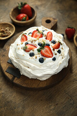 Pavlova meringue dessert with fresh berries