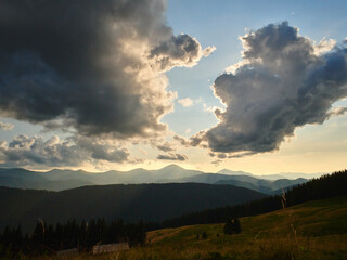 Naklejka na ściany i meble summer sunset at charphatian mountains with view on Chornogora