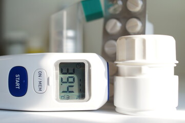 thermometer to the infrared,medicines for fever and cough - hyperthermia.Coronavirus, (covid -19) - obrazy, fototapety, plakaty