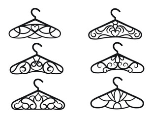Set of decorative hangers. Collection of silhouettes of stylized  openwork hangers for clothes, atelier, wedding salon. Wardrobe hangers in vintage style. Vector illustration on white background. - obrazy, fototapety, plakaty