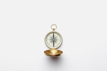 Golden compass on white background concept - direction, top view