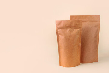 Pouch bags mockup neutral beige background monochrome. Merchandise packaging Blank brown kraft paper pack coffee beans product template copy space Tea food snack delivery Shop store sale demonstration