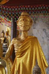 Golden Buddha Statue of torture in Ratchaburi province, Thailand